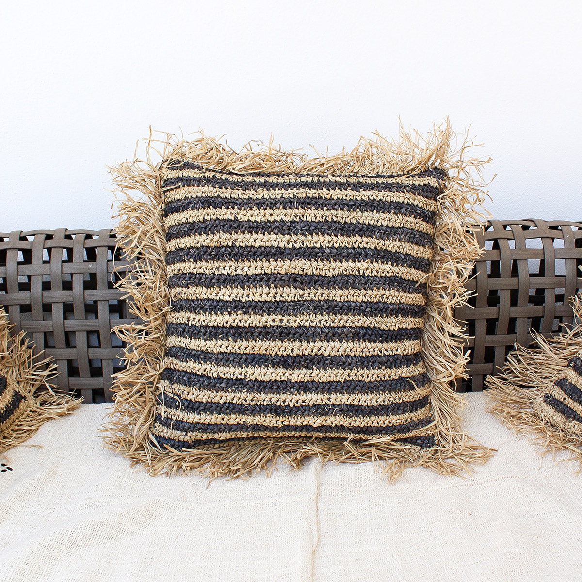 Sunda - raffia pillow cover with black stripe