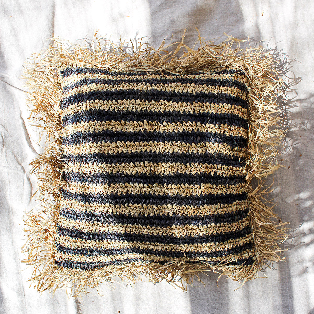 Sunda - raffia pillow cover with black stripe